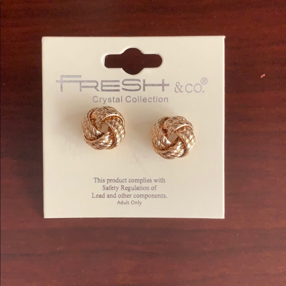 Gold stud earrings